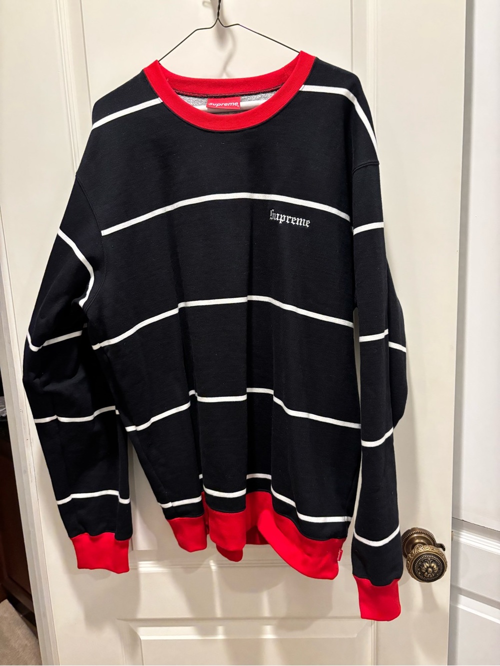 Supreme Black Crewneck with White Stripes and Red Trim